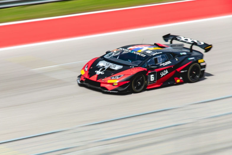 the ferrari cup race car takes a corner