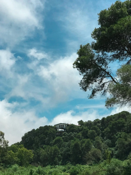 a house that is sitting on top of a hill