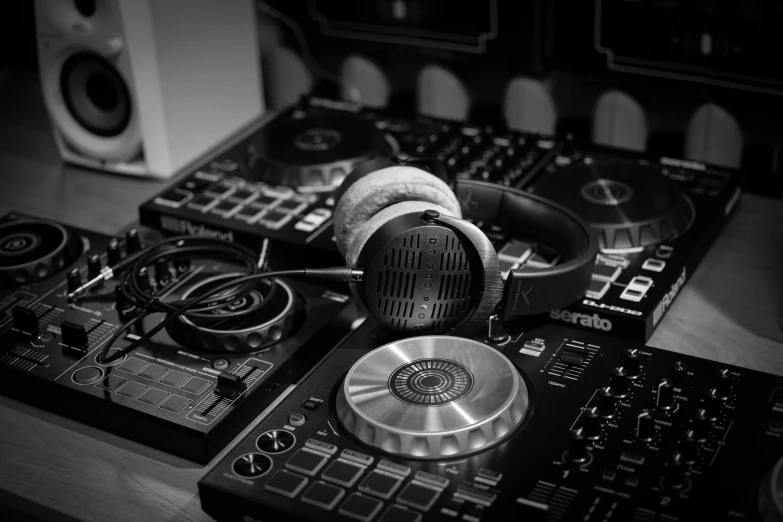 a pair of headphones on top of a dj's mixing desk