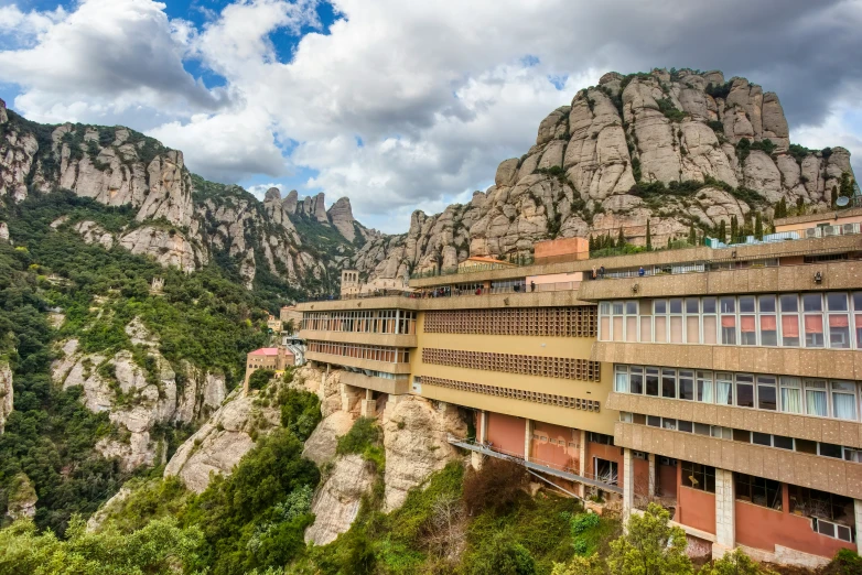 a large building sitting on top of a mountain