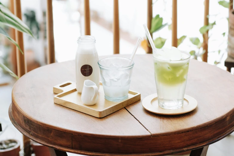 two drinks that are on a small tray