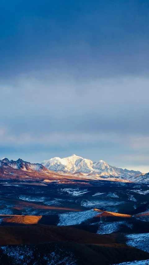 an image of snow covered mountains and valleys at sunrise