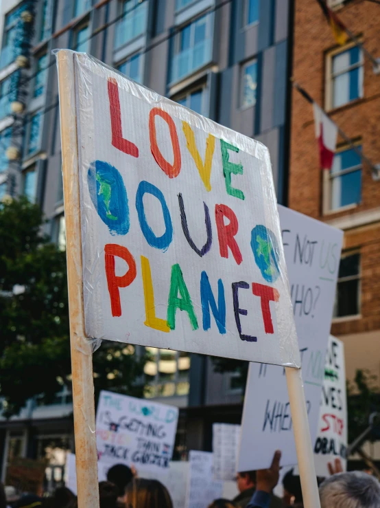 a protest on the street in front of a building