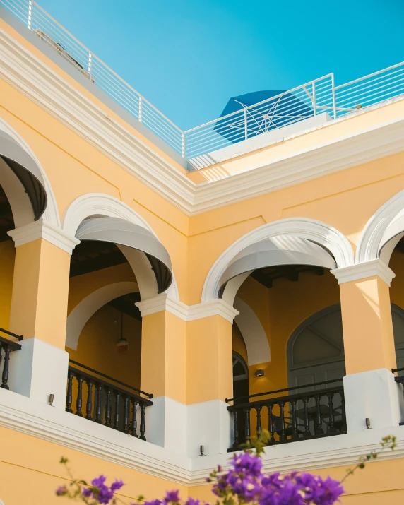 this is an interior courtyard with arches and flowers