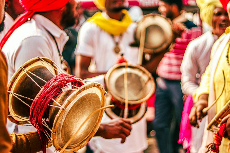 drums being played by men and women, indian festival