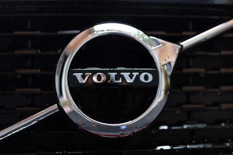 a volvo badge sits on top of a car