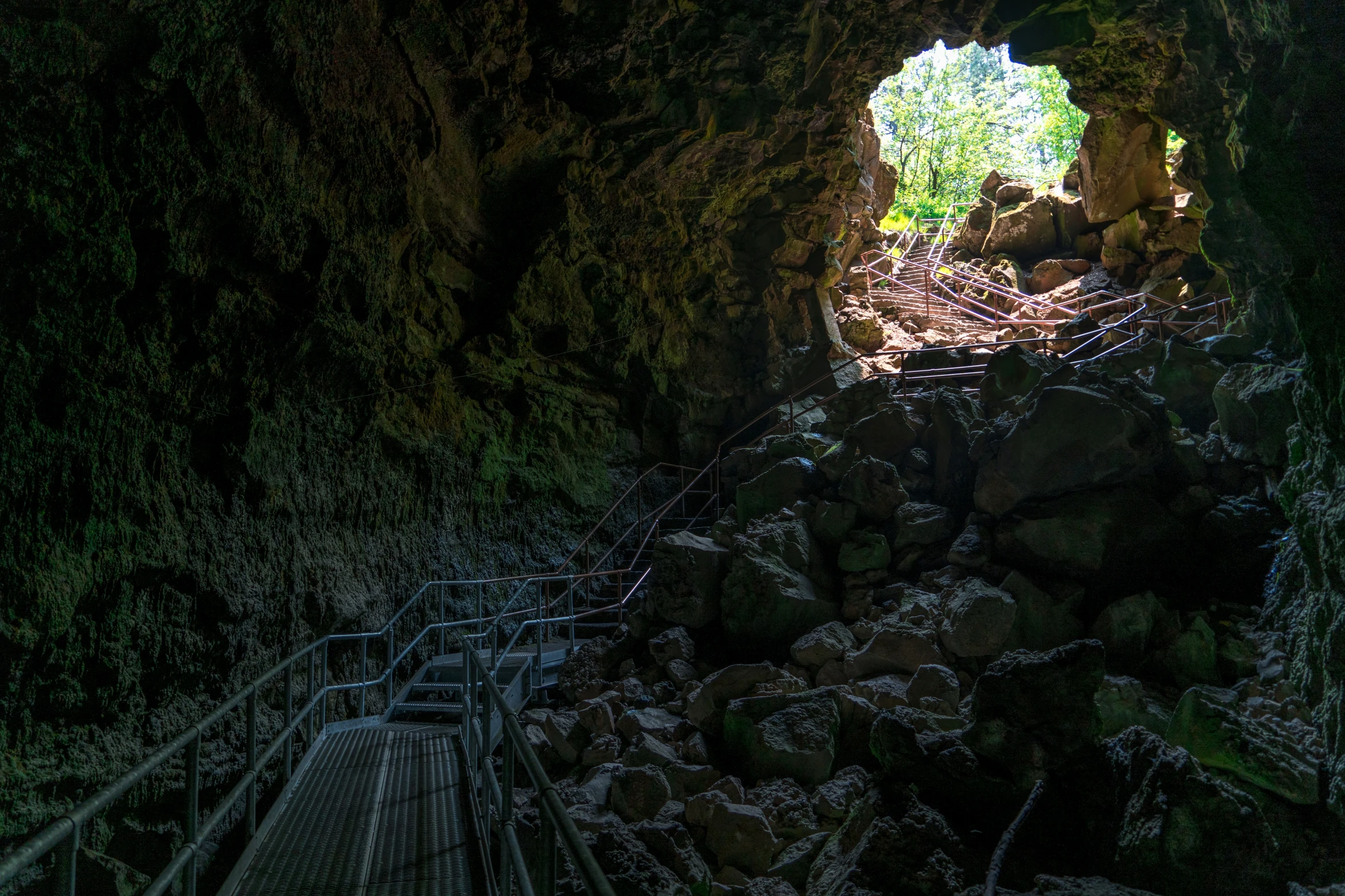 a tunnel is open with stairs leading to the entrance