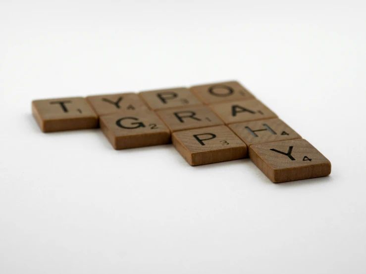 a set of scrabble letters arranged in a crossword alphabet
