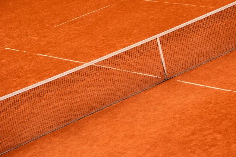 a man standing on top of a tennis court holding a racquet