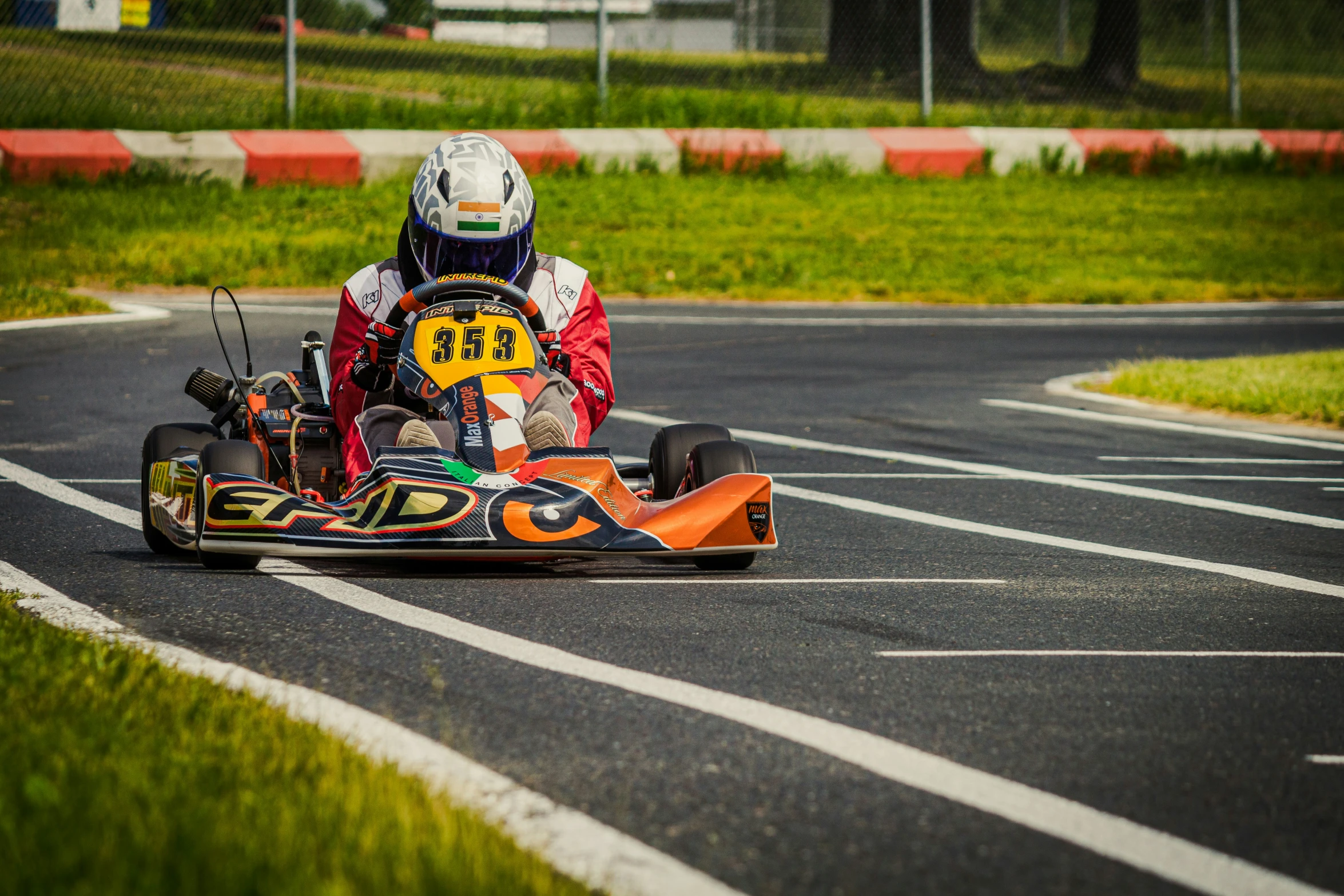 a person riding a go kart on top of a street