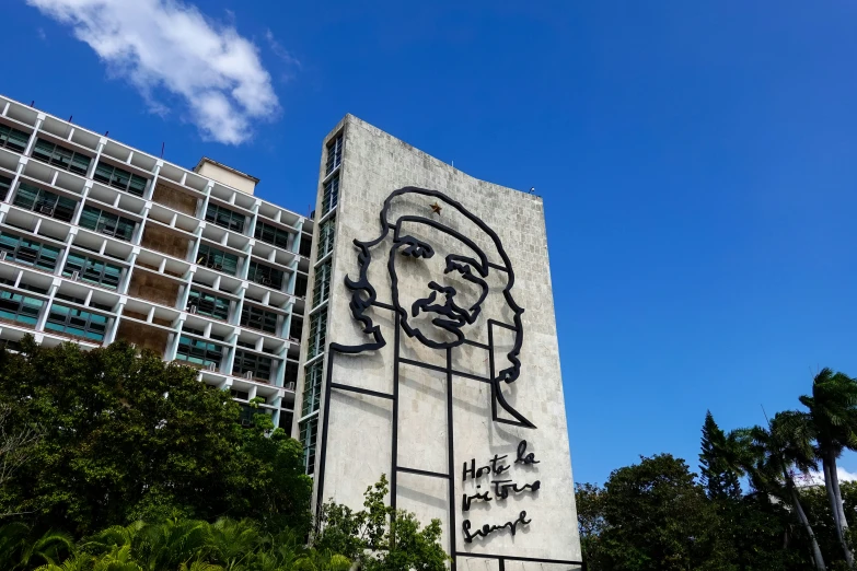 a large, modern building with a graphic image on the side