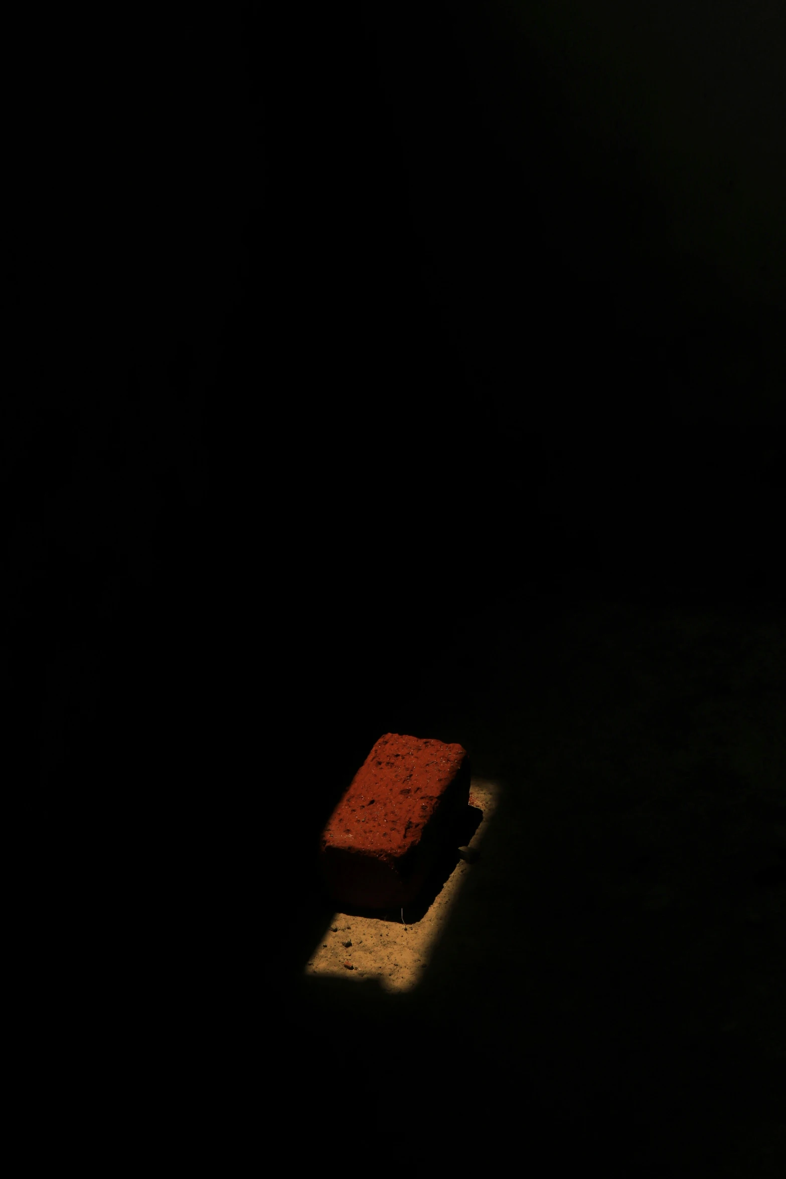 a bright red piece of cloth sitting in the dark