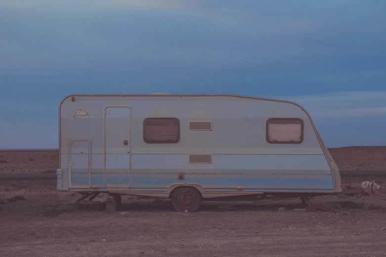 an rv is parked on the side of the road