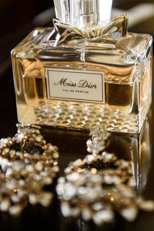 a fancy perfume bottle with beads around it