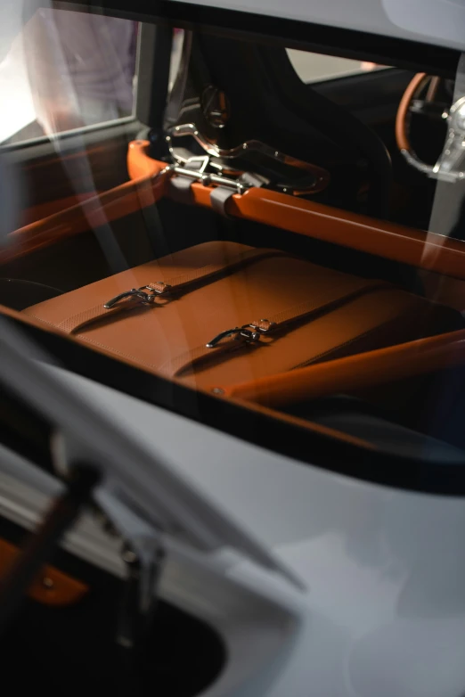 an image of an open car door with luggage inside