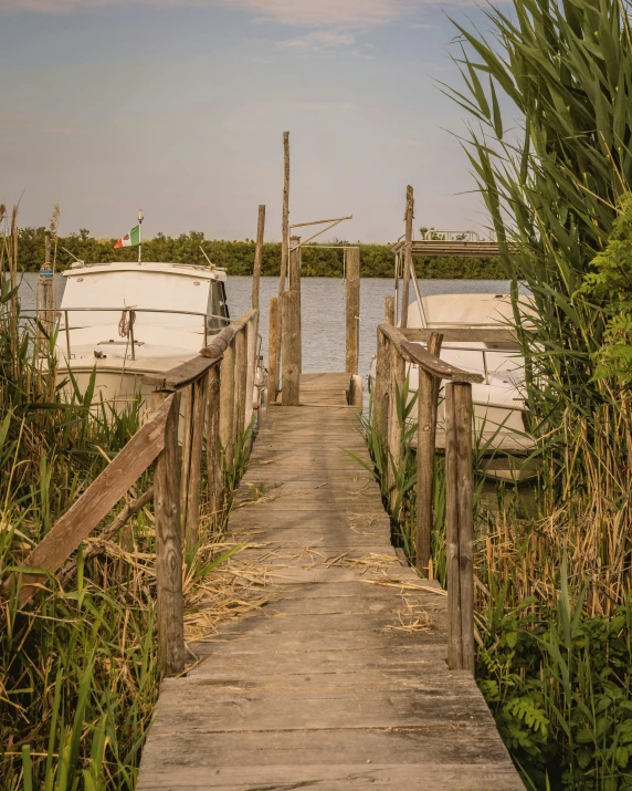 a dock has boats docked in the water