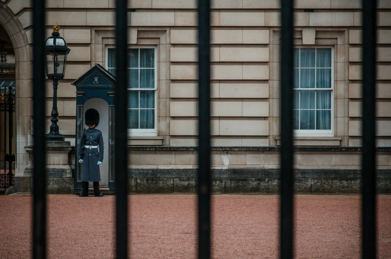 a security guard standing in front of a guard station