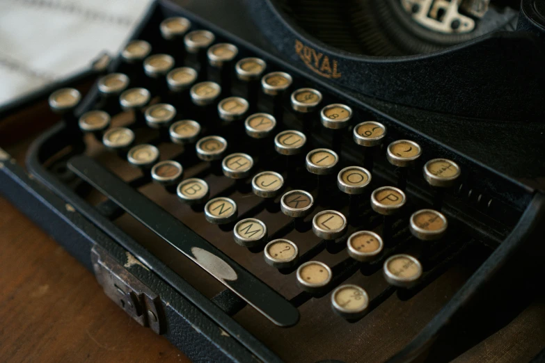 an old fashioned typewriter is sitting on a table