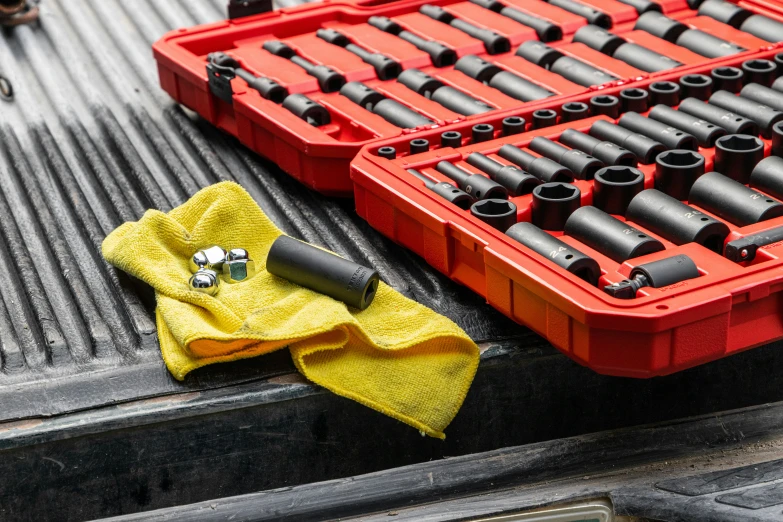 a number of tools in a red crate