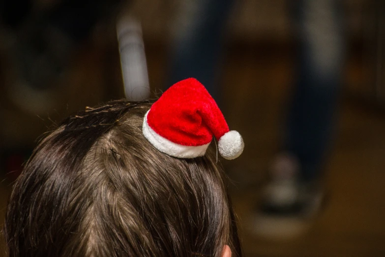 a boy with a santa hat on his head