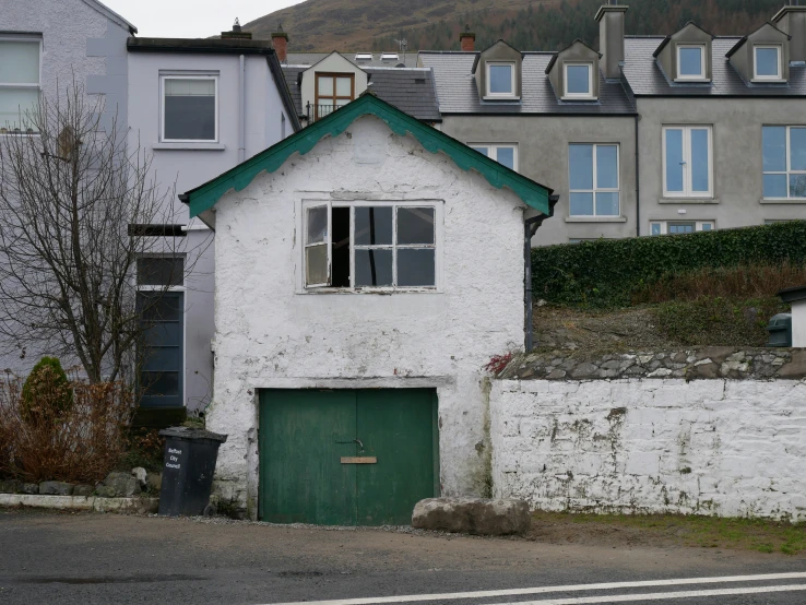 a picture of some buildings with green doors