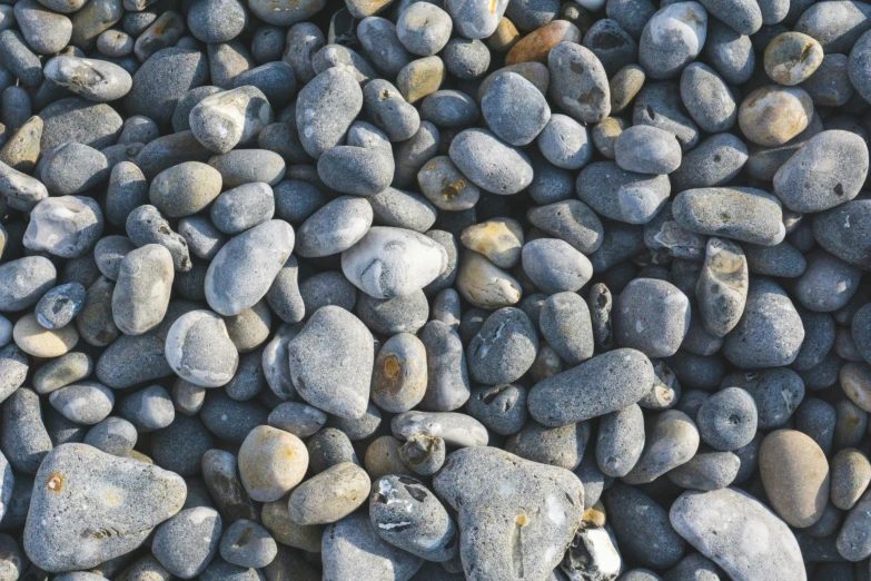 many rocks and gravel are arranged on one side