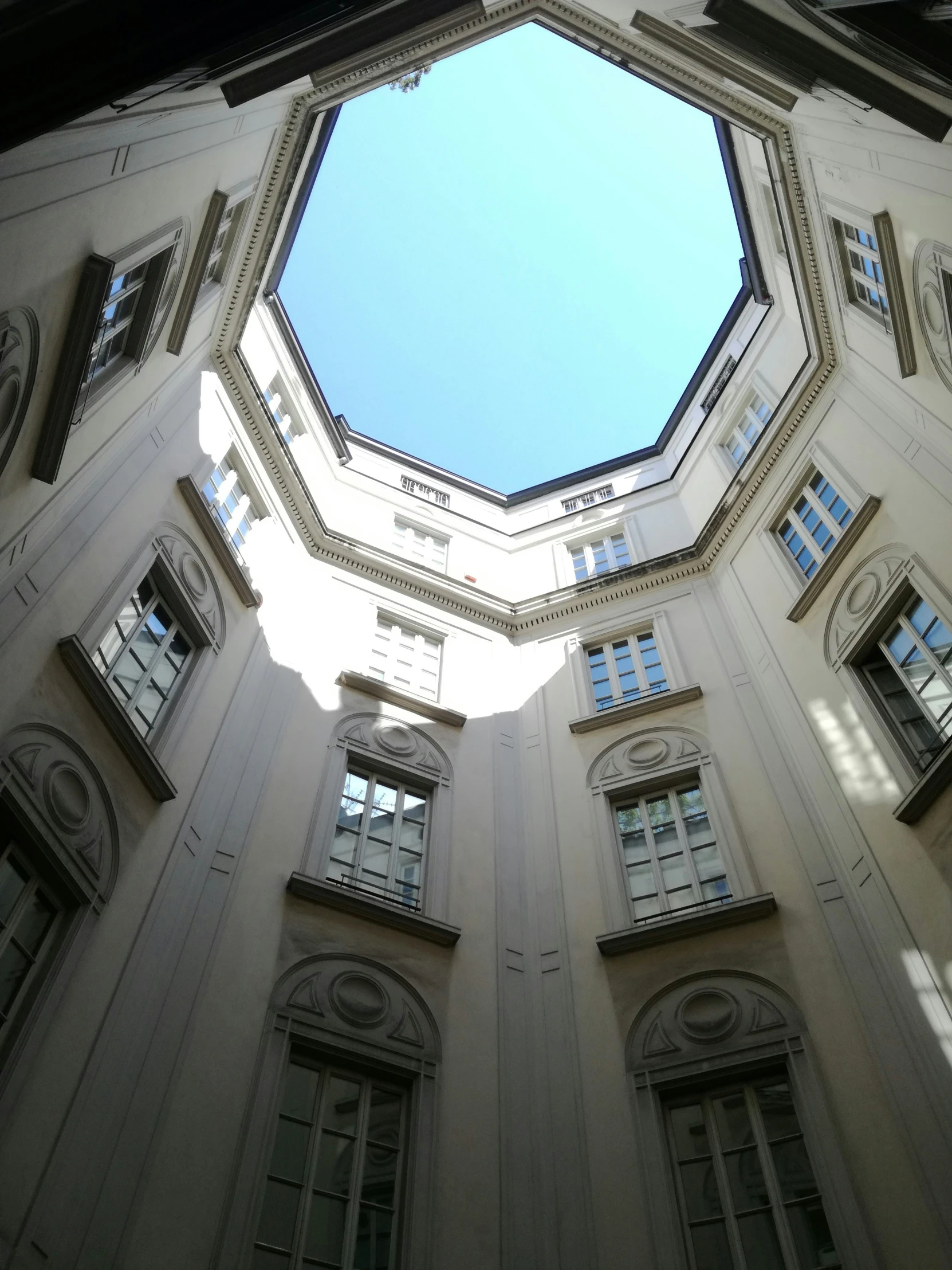 looking up at the top half of an architectural building