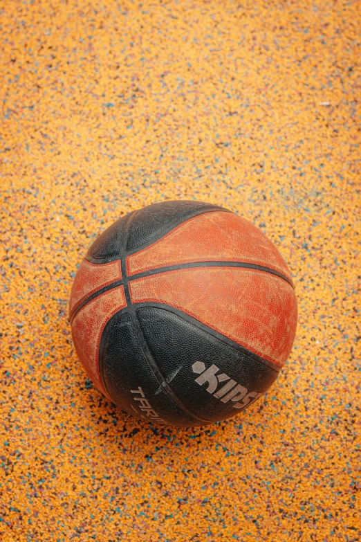basketball on the floor has stars all over it
