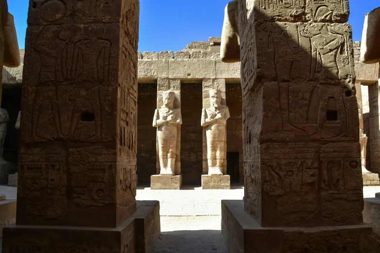 an empty stone shrine with a number of sculptures