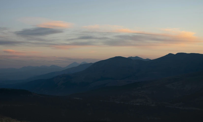 a dark mountain that has some mountains on it