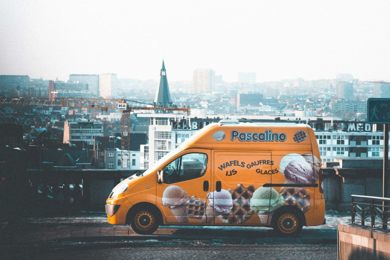 a food truck is parked by the curb