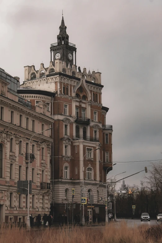 a view of an old building that has a clock on the front