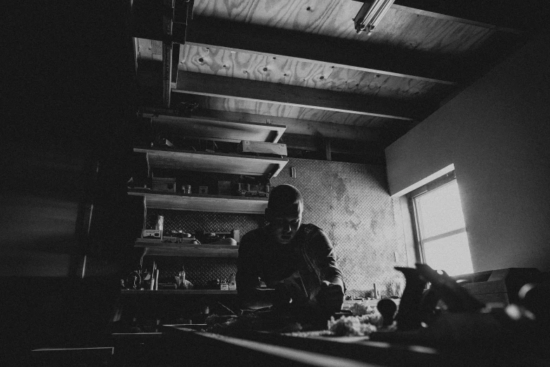 a man in the kitchen sitting and eating