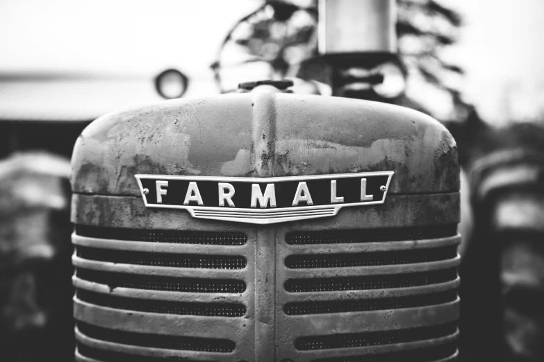 a farmall grill is shown with an antique farm tractor