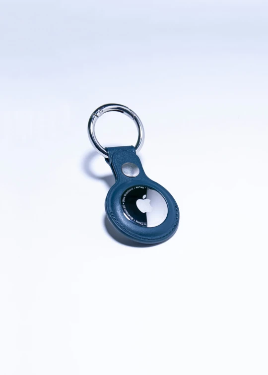 an open bottle opener with a chain attached