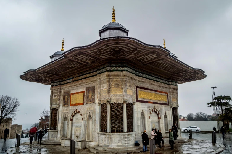 a building with two people standing around