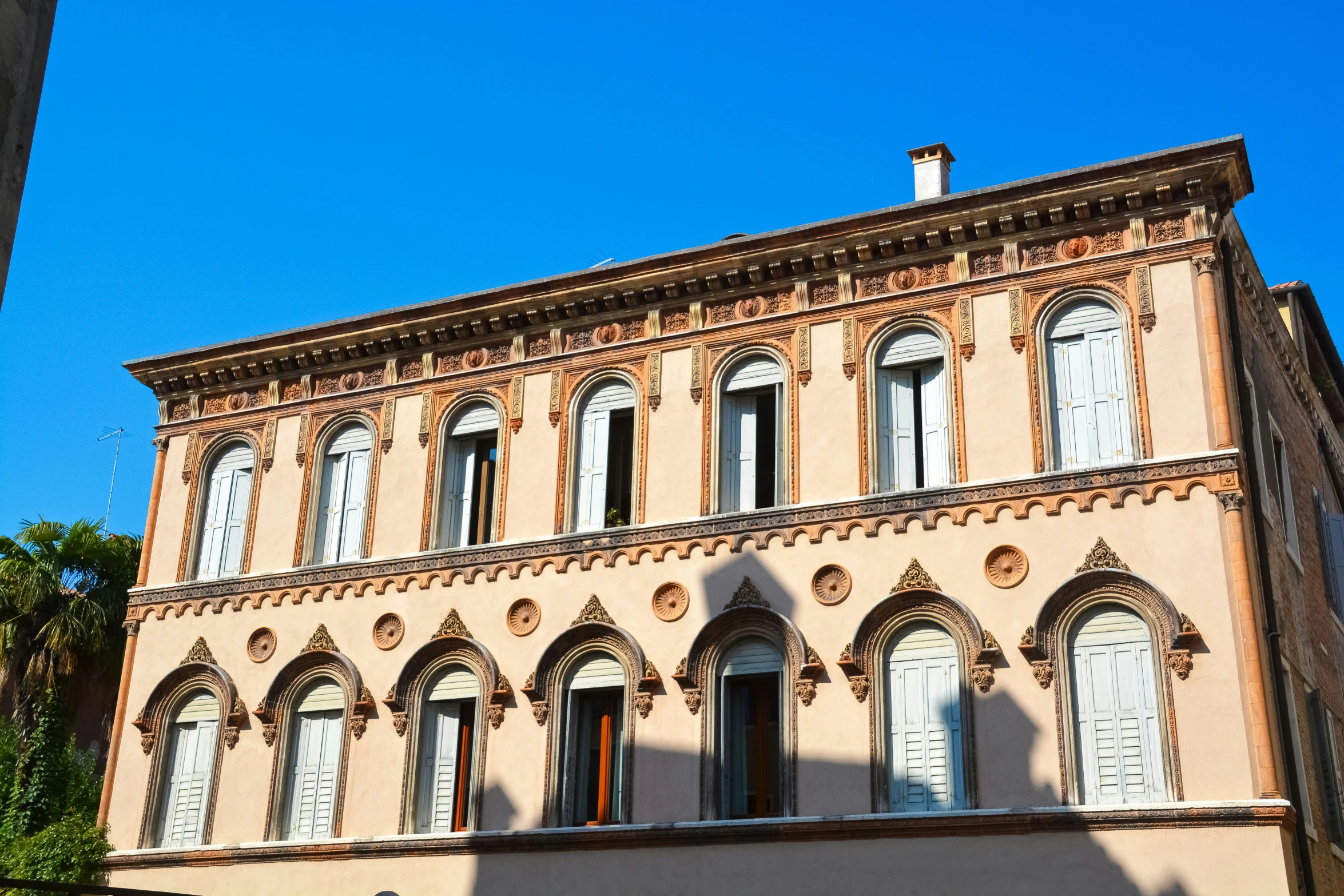 a large building with windows in a city