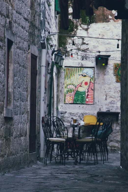 an outside setting with tables and chairs is shown