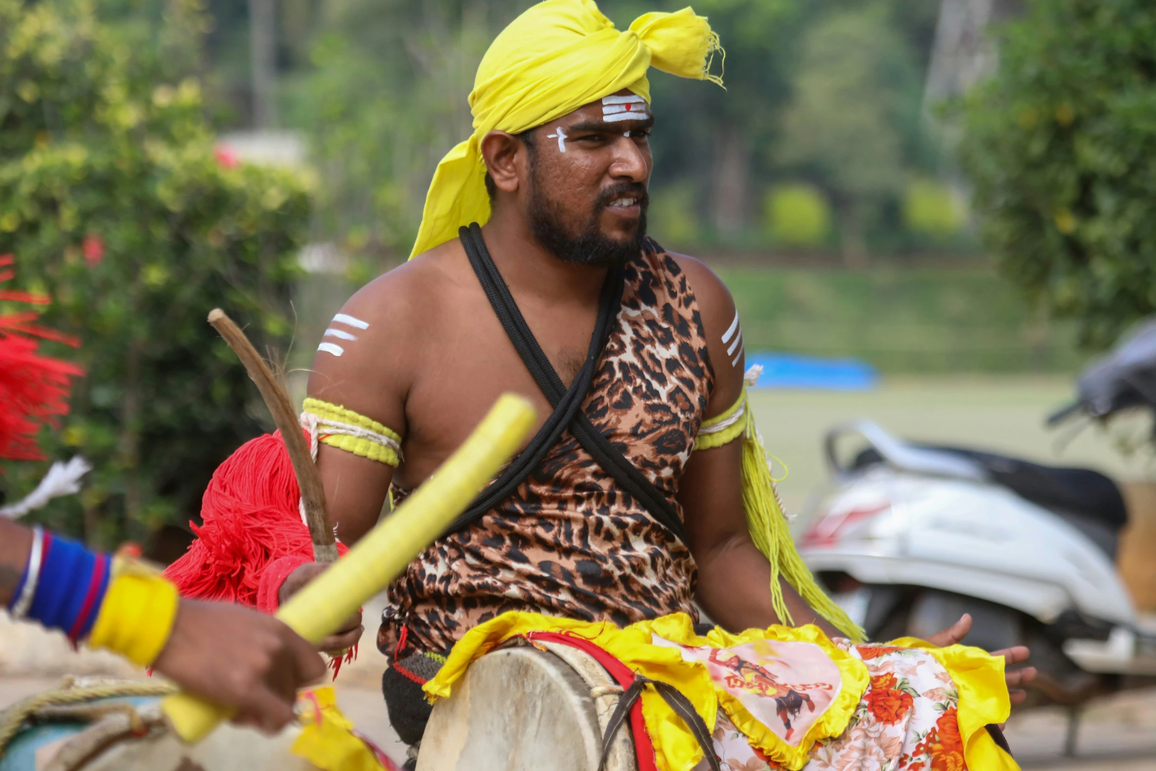 a person that is sitting on top of a drum