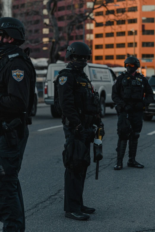 two uniformed police stand on the road