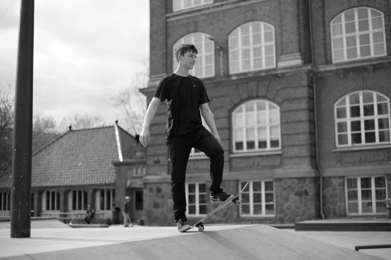 the boy is practicing his moves on the skateboard