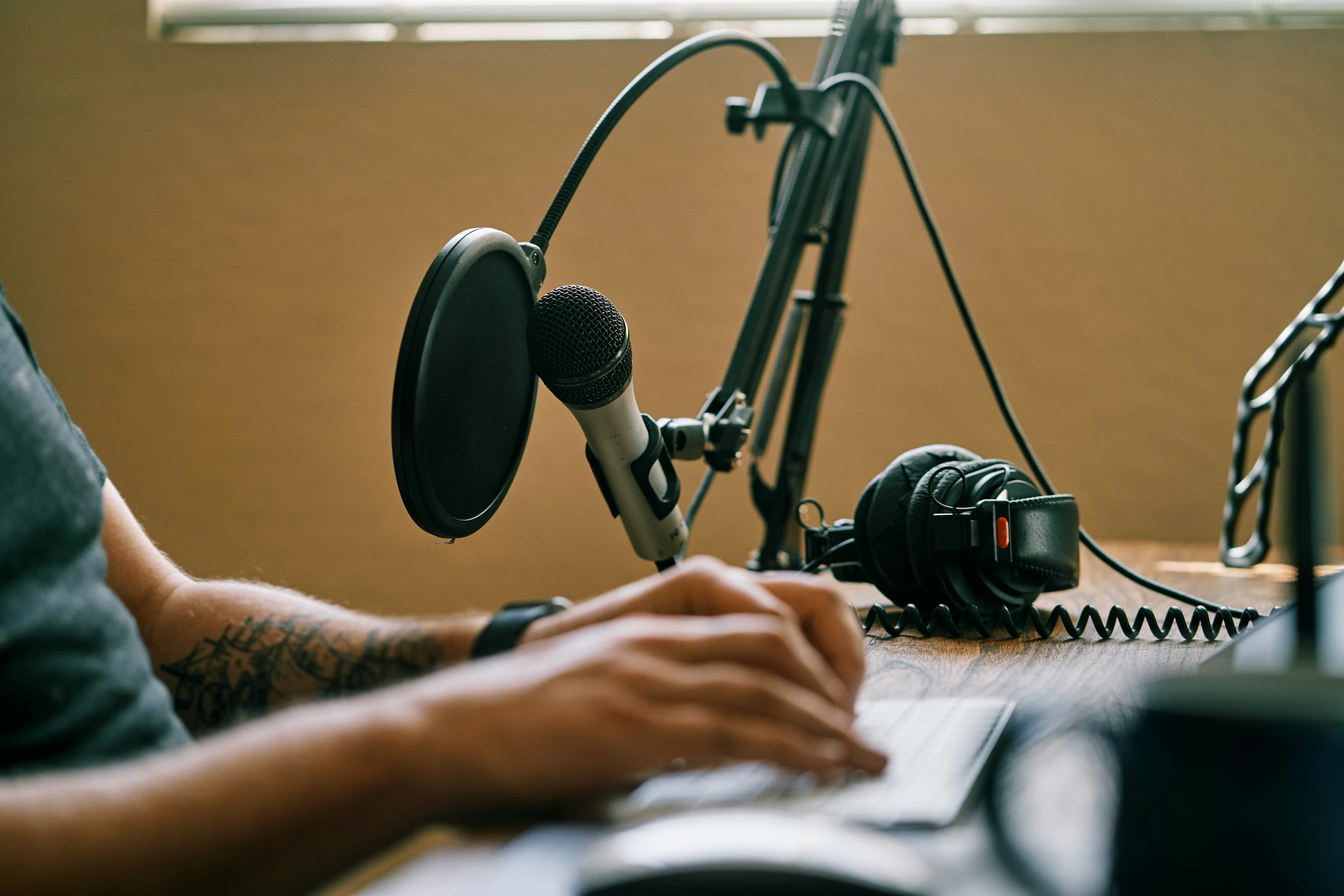 a man is using a microphone and some electronic equipment