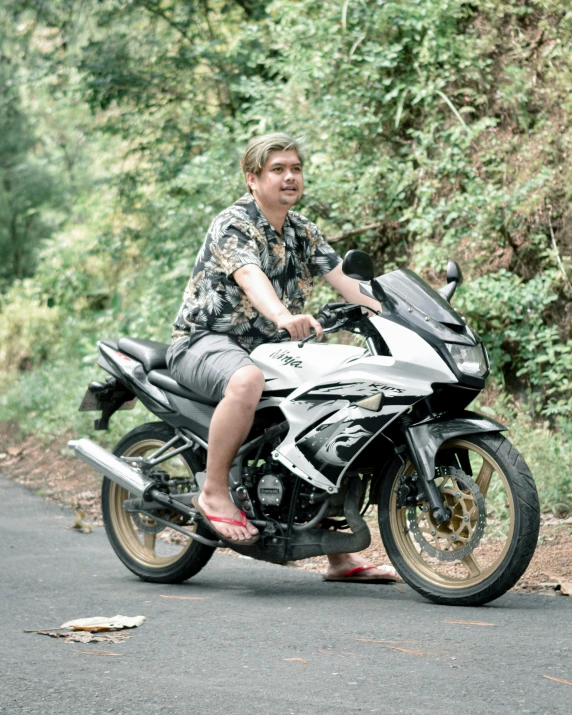 a man on his motorcycle posing for a po