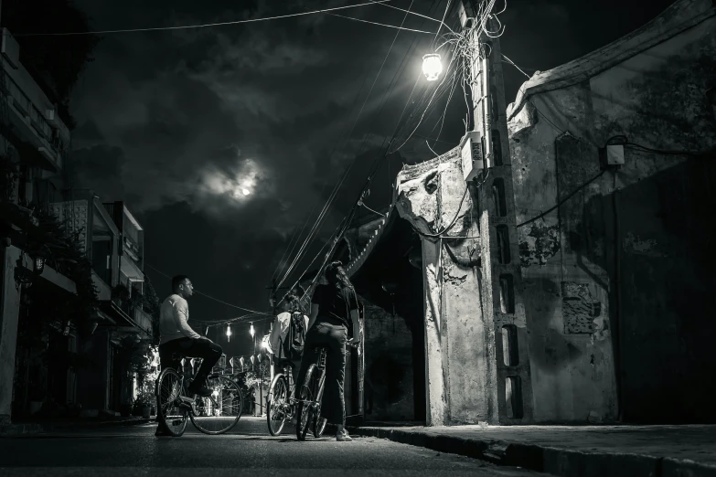 black and white po of motorcyclist at night