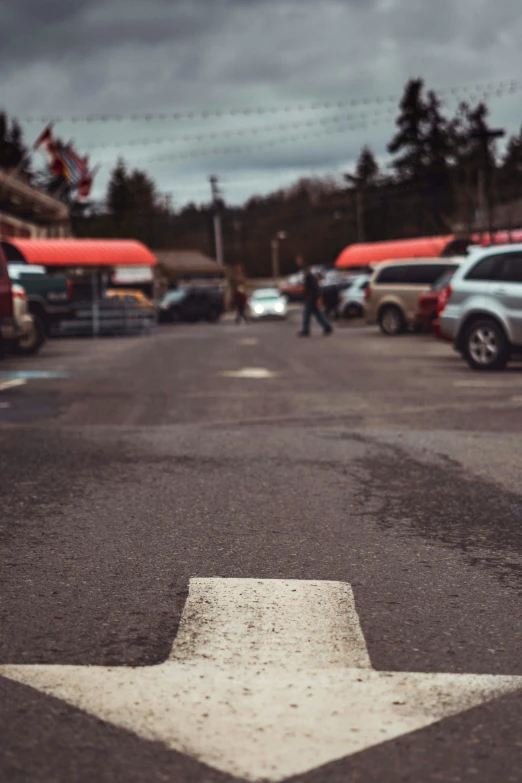 a stop sign in the middle of a parking lot