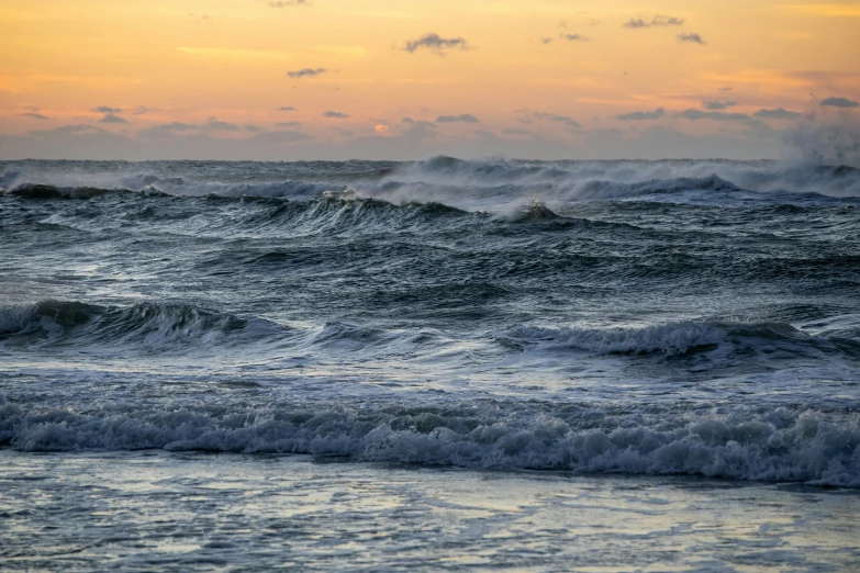 a couple of waves that are in the ocean