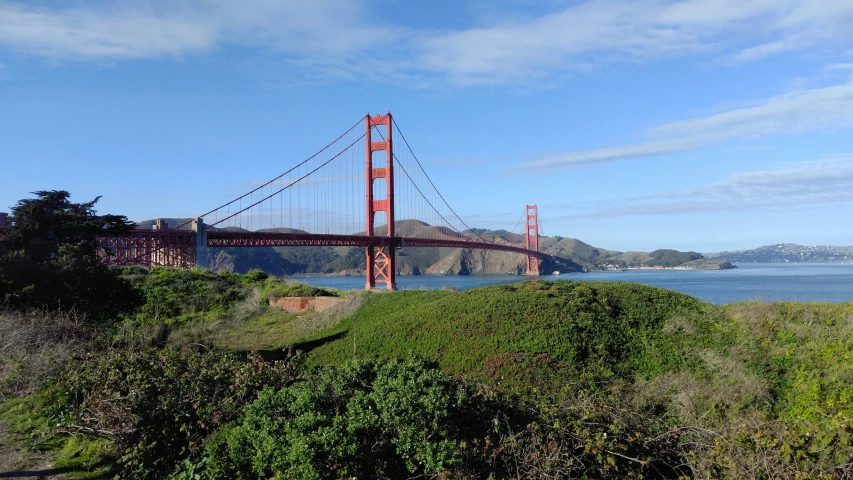 view of the golden gate bridge from the banks of the river