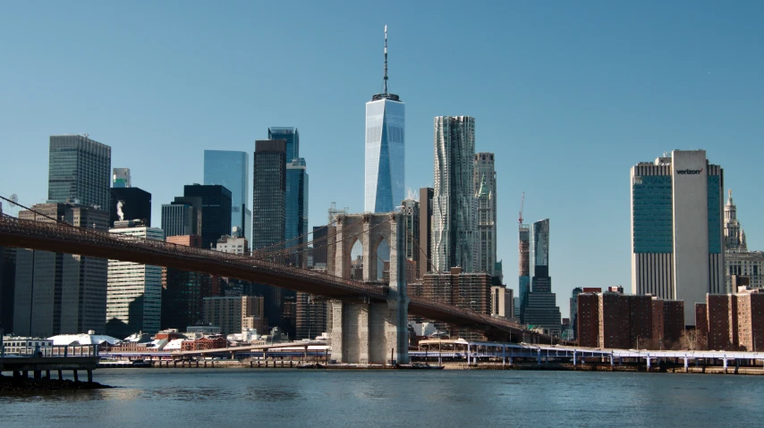 there is a tall bridge going over a city