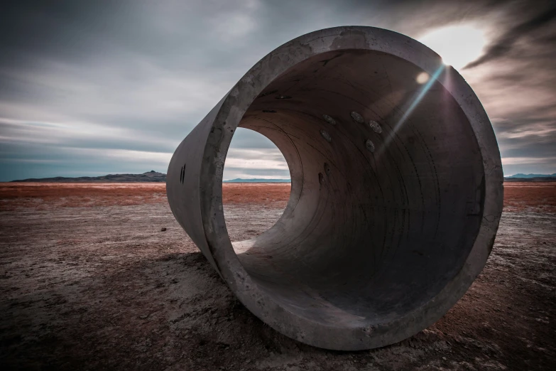 a concrete object is sitting on the sand