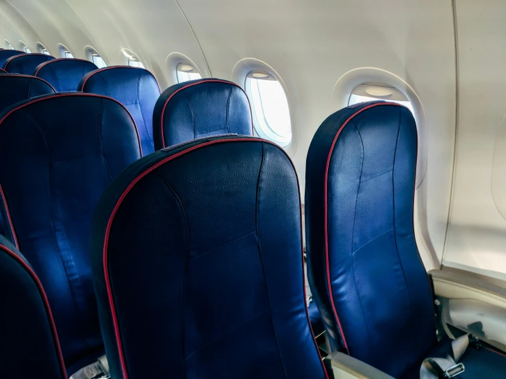 rows of empty seats inside of an airplane